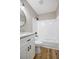 Modern bathroom featuring granite countertop, white vanity, bathtub/shower combo, and wood-look flooring at 2831 Fifer Dr, Deltona, FL 32738