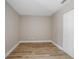 Bright and airy bedroom featuring wood-look flooring, fresh neutral paint, and a closet at 2831 Fifer Dr, Deltona, FL 32738