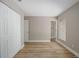 Spacious bedroom boasts wood-look flooring, a closet, fresh paint, and a bright window view at 2831 Fifer Dr, Deltona, FL 32738