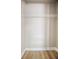 A closet with a wire shelf and wood flooring offers simple storage at 2831 Fifer Dr, Deltona, FL 32738