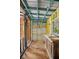 Shed interior with yellow paint, small sink and wood floor at 2831 Fifer Dr, Deltona, FL 32738