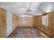 Shed interior with wood walls, ceiling fan and door at 2831 Fifer Dr, Deltona, FL 32738