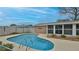Backyard pool with patio and sunroom, surrounded by a manicured lawn at 2970 Lantern Dr, South Daytona, FL 32119