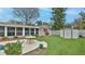 Backyard with pool, patio, lawn, shed, and sunroom, perfect for outdoor living at 2970 Lantern Dr, South Daytona, FL 32119
