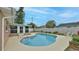 Exterior view of backyard with pool, lawn, and sunroom, perfect for outdoor entertaining at 2970 Lantern Dr, South Daytona, FL 32119