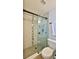 Bathroom featuring a glass shower door and mosaic tile at 2970 Lantern Dr, South Daytona, FL 32119