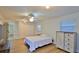 Bright bedroom features wood floors, ceiling fan, natural light, and closet storage at 2970 Lantern Dr, South Daytona, FL 32119