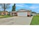 A lovely single-Gathering home has an attached two-car garage and well-maintained landscaping at 2970 Lantern Dr, South Daytona, FL 32119