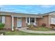 Charming front entrance with a brick accent, and a small seating area at 2970 Lantern Dr, South Daytona, FL 32119