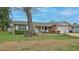 Single-story home with a well-manicured lawn, showcasing the front yard and inviting curb appeal at 2970 Lantern Dr, South Daytona, FL 32119
