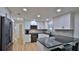Well-lit kitchen showcasing modern white cabinetry, black appliances, and black countertops at 2970 Lantern Dr, South Daytona, FL 32119