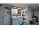Functional laundry area features storage cabinets and essential appliances for efficient home management at 2970 Lantern Dr, South Daytona, FL 32119