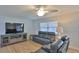 Comfortable living room featuring hardwood floors, neutral paint, and comfortable furniture at 2970 Lantern Dr, South Daytona, FL 32119