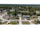 Quaint neighborhood featuring a single-story home with a long driveway and mature trees at 3013 Hunkin Cir, Deltona, FL 32738