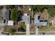 Birds eye view of a well-kept home with a long driveway, tidy yard and mature landscaping at 3013 Hunkin Cir, Deltona, FL 32738