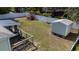 A backyard with a storage shed, a screened porch and a raised garden with a white vinyl fence at 3013 Hunkin Cir, Deltona, FL 32738