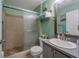 Bathroom featuring tiled walk-in shower, modern sink, and towel rack at 3013 Hunkin Cir, Deltona, FL 32738