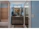 Well-lit bathroom offering a vanity with storage, mirror, and shower-tub combination at 3013 Hunkin Cir, Deltona, FL 32738