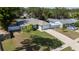 Lovely single-story home featuring a lush front yard, white fence, and an attached garage at 3013 Hunkin Cir, Deltona, FL 32738