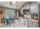 The kitchen combines function and style, featuring modern appliances, countertops, and a view to the backyard at 3013 Hunkin Cir, Deltona, FL 32738