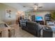 The inviting living room features tile floors, a comfortable sofa, and views of the front door at 3013 Hunkin Cir, Deltona, FL 32738