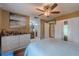 Bright main bedroom featuring wood floors, ensuite bath, and ample closet space at 3013 Hunkin Cir, Deltona, FL 32738