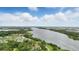 Beautiful aerial view of the river from the home and surrounding landscape with beautiful clouds at 317 River Front Way, Edgewater, FL 32141