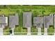 Aerial view of neighborhood homes showing roof lines, driveways and landscaping features at 317 River Front Way, Edgewater, FL 32141