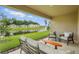 Relaxing back patio with a view of the pond and fountain at 317 River Front Way, Edgewater, FL 32141