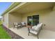 A lovely back patio with a comfortable seating area, perfect for outdoor relaxation at 317 River Front Way, Edgewater, FL 32141