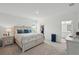 Inviting bedroom with a comfortable bed, soft lighting, and an organized walk-in closet at 317 River Front Way, Edgewater, FL 32141