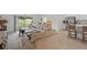 Spacious living room with sliding glass doors that lead to a patio and view of the backyard at 317 River Front Way, Edgewater, FL 32141