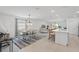 Open-concept area with a dining area and kitchen island with barstool seating at 317 River Front Way, Edgewater, FL 32141
