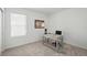 Bright office with a desk, neutral walls, and light colored carpet at 317 River Front Way, Edgewater, FL 32141