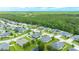 Aerial view of a house with a lush, mature yard in a neighborhood surrounded by a dense forest at 32 Abacus Ave, Ormond Beach, FL 32174