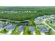 Aerial view of a neighborhood with a house in close proximity to a serene lake at 32 Abacus Ave, Ormond Beach, FL 32174