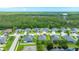 Aerial view showing a neighborhood's location near a lush forest and a striking water tower at 32 Abacus Ave, Ormond Beach, FL 32174