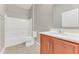 Bright bathroom featuring a shower/tub combo, tiled floors, and a vanity with storage at 32 Abacus Ave, Ormond Beach, FL 32174