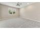 Spacious bedroom featuring neutral paint, carpet floors, ceiling fan, and natural light from the window at 32 Abacus Ave, Ormond Beach, FL 32174