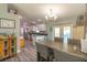 Open concept dining room offering a seamless transition to the kitchen and outdoor area at 3324 Royal Palm Dr, Edgewater, FL 32141