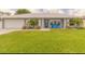 Charming single-story home with a well-manicured lawn and inviting curb appeal at 3324 Royal Palm Dr, Edgewater, FL 32141