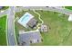 An aerial view of a community swimming pool, playground, and parking lot at 33436 Shutterfly Way, Sorrento, FL 32776