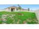Expansive backyard featuring a well-maintained lawn, white fence, and young trees, offering privacy and space at 33436 Shutterfly Way, Sorrento, FL 32776