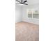Inviting bedroom with a ceiling fan and a window providing ample natural light and views at 33436 Shutterfly Way, Sorrento, FL 32776