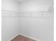 Walk-in closet with carpeted flooring and a white wire shelving system installed at 33436 Shutterfly Way, Sorrento, FL 32776