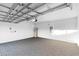 Spacious garage featuring neutral carpeting, an automatic door opener, and ample space for parking and storage at 33436 Shutterfly Way, Sorrento, FL 32776