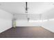 Spacious garage featuring neutral carpeting, an automatic door opener, and ample space for parking and storage at 33436 Shutterfly Way, Sorrento, FL 32776