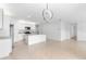Open kitchen featuring an island, stainless steel appliances, and tile floors at 33436 Shutterfly Way, Sorrento, FL 32776