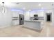 Bright open concept kitchen featuring an island, stainless steel appliances, and LED accents at 33436 Shutterfly Way, Sorrento, FL 32776