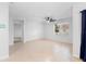 Bright open concept living room with a ceiling fan and tile flooring at 33436 Shutterfly Way, Sorrento, FL 32776